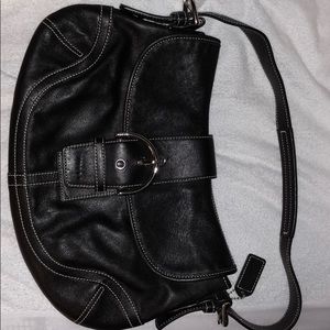 Coach black leather handbag with white stitching